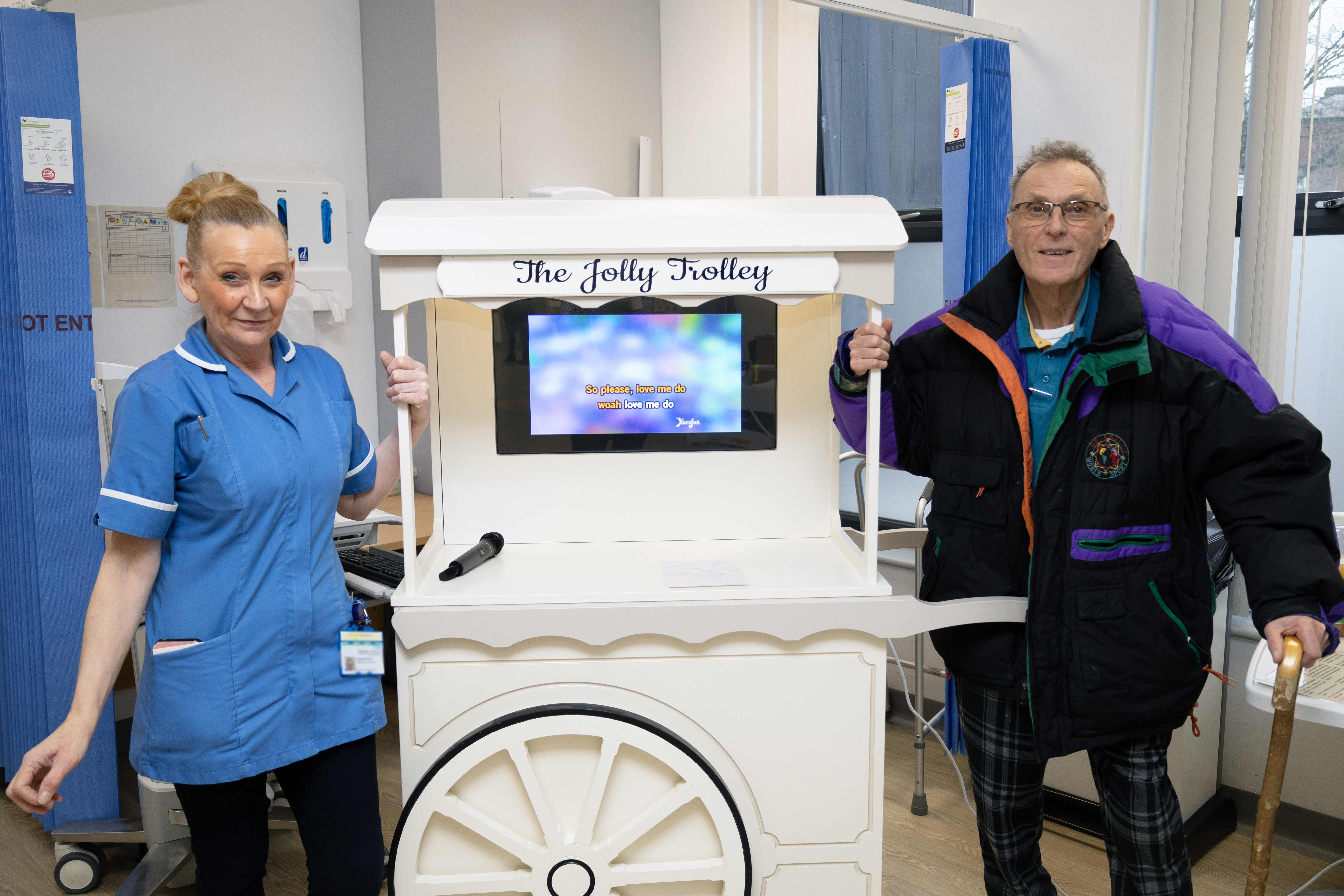Staff and patient with Jolly Trolley
