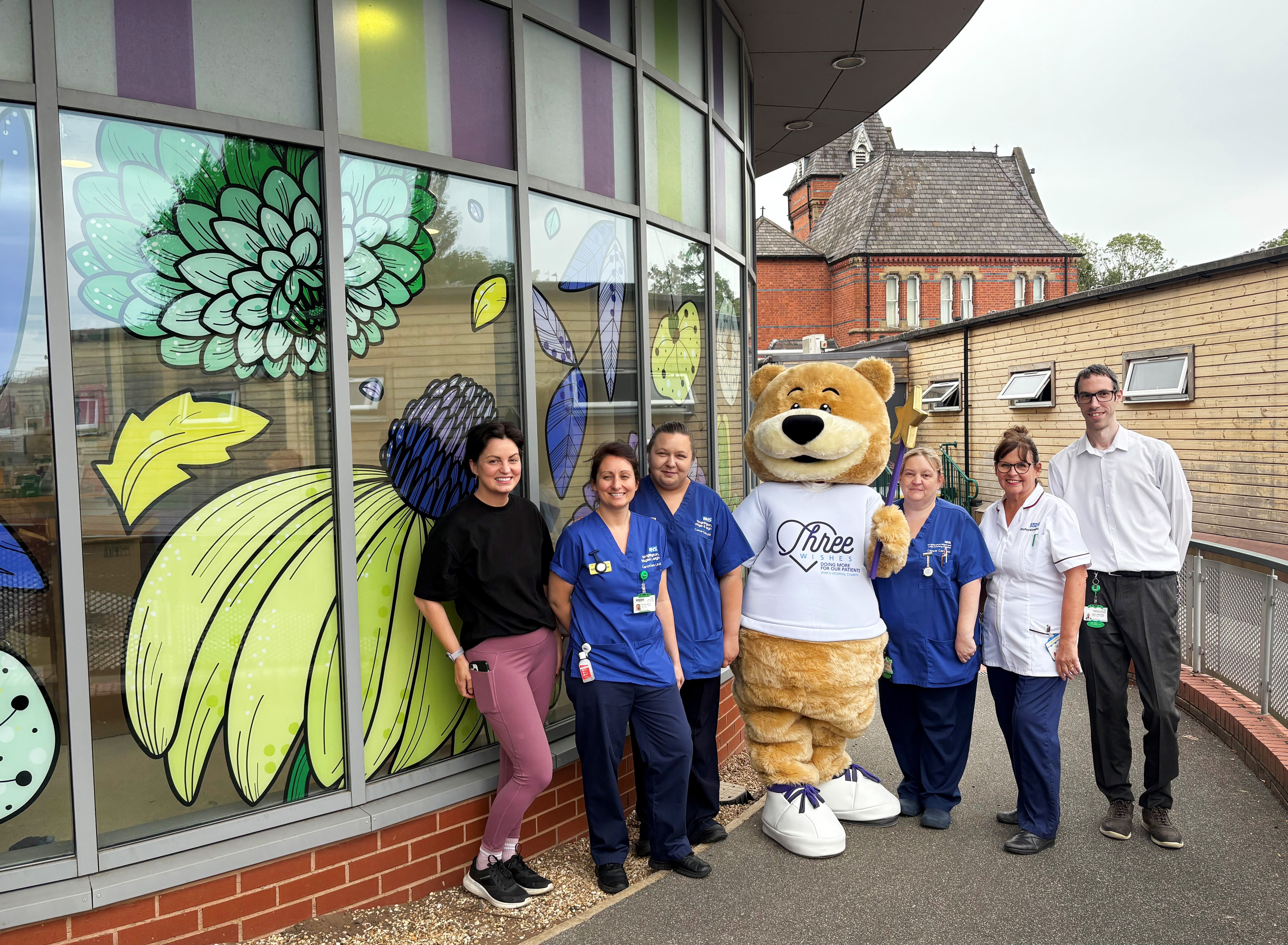 Cancer Care Centre Flower Artwork group picture with Albert the Bear (1)