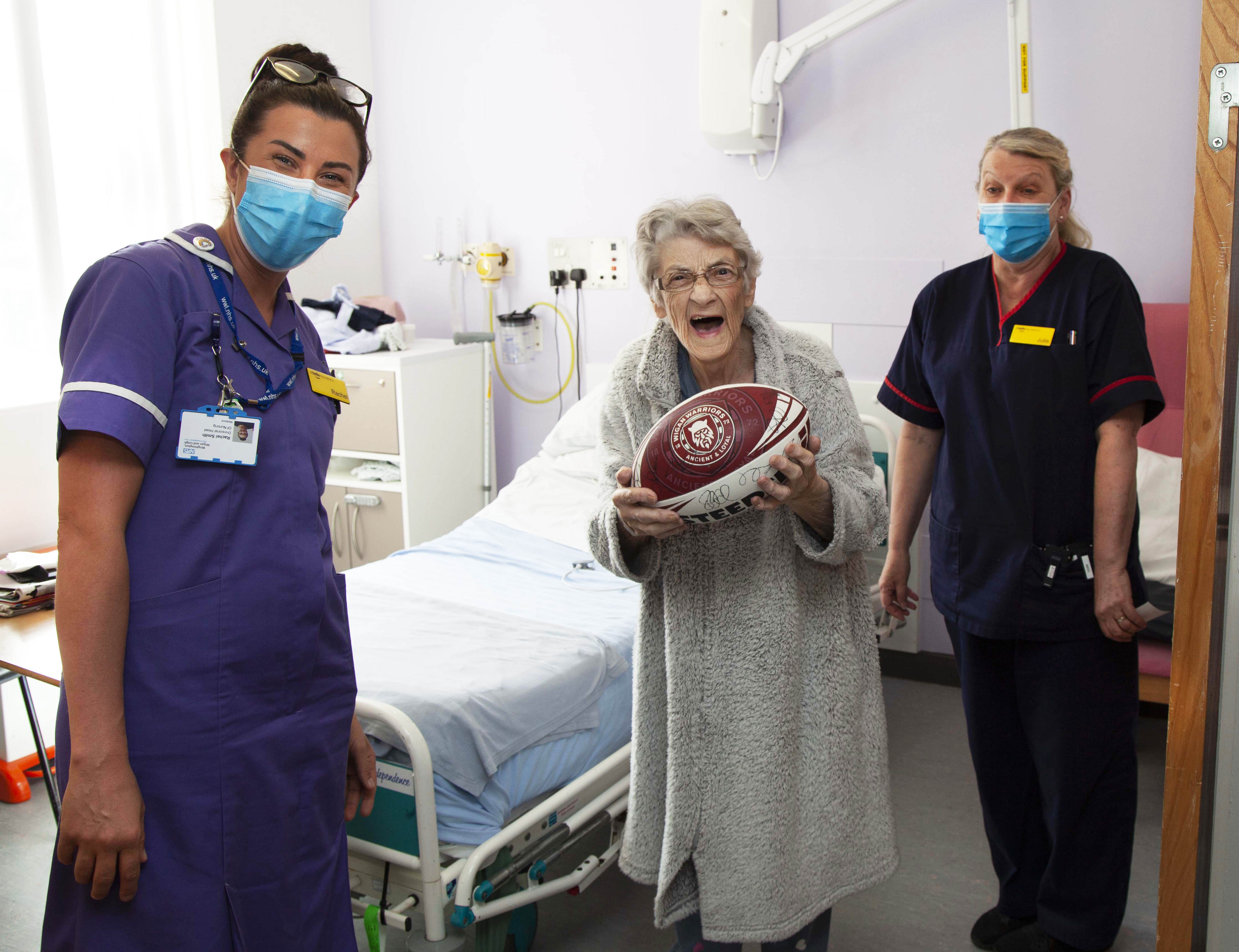 Staff with Edith and her signed rugby ball