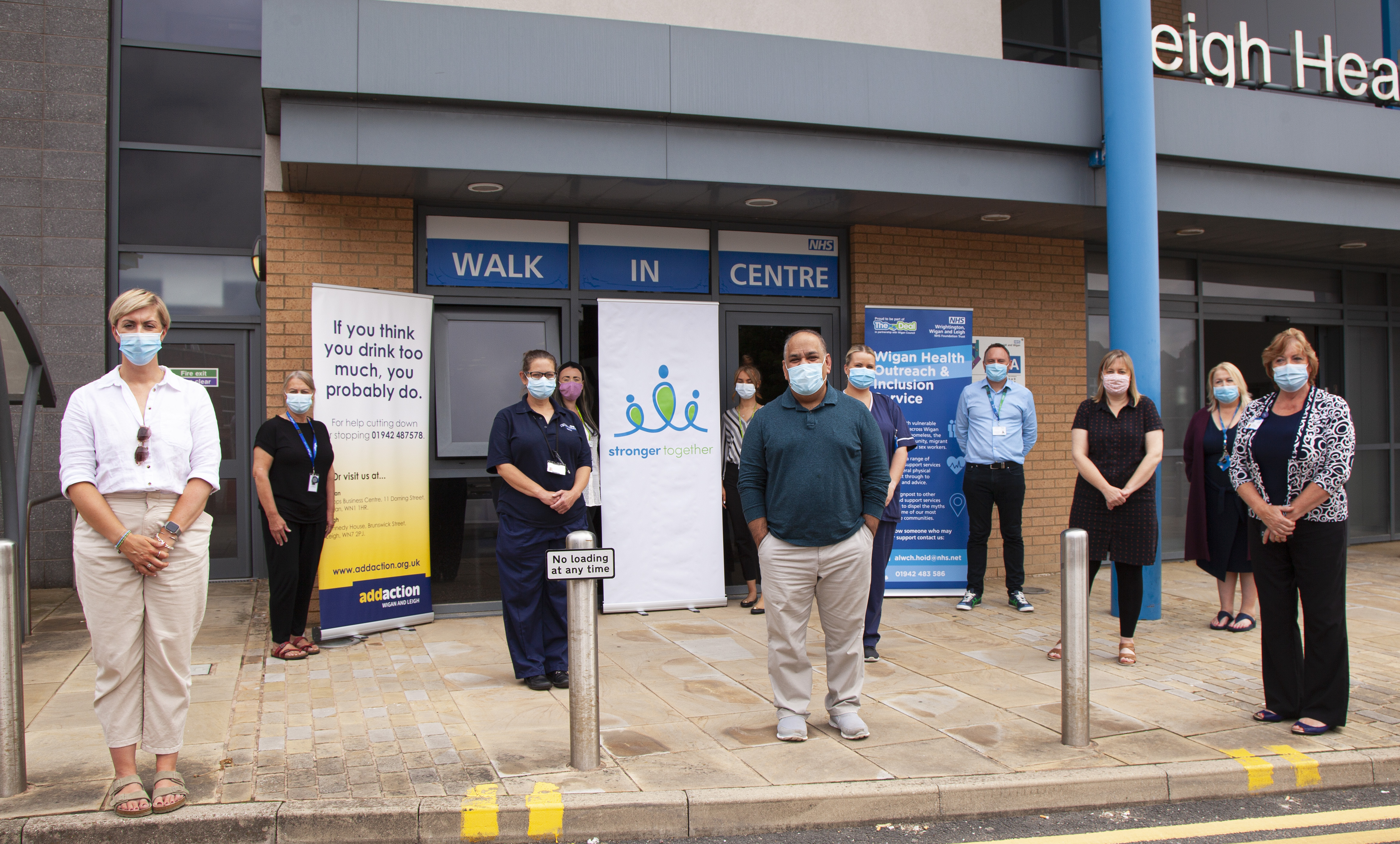 Staff from the Stronger Together team pose for a photograph at Leigh Walk-in Centre